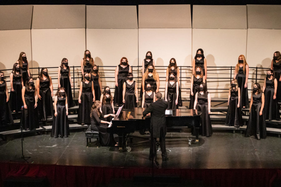 The Belle Chanson chorus stands spread out on the stage as Mr. Taylor directs from the front, leading them through the piece for their first and last in-person concert of the year. “Its nice to know Im going to have one more experience in Meyer Hall, especially with the other seniors, which most of us have been together [since] middle school,” vocal senior Aishworya Thapaliya said. 