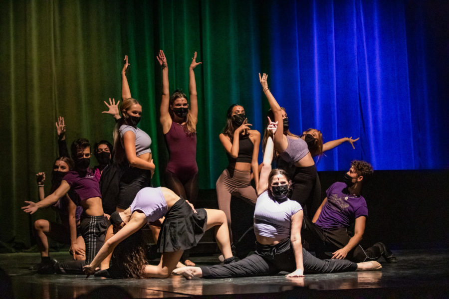 Dancing to Lady Gaga’s ‘Born This Way,’ members of the cast strike their final poses with a rainbow background behind them.