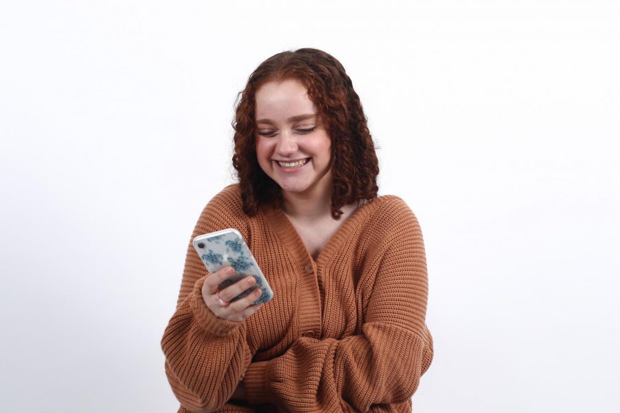 Jordan Teitelbaum sorts through recent Dreyfoos Beauties submissions to prepare for her next Instagram post. 