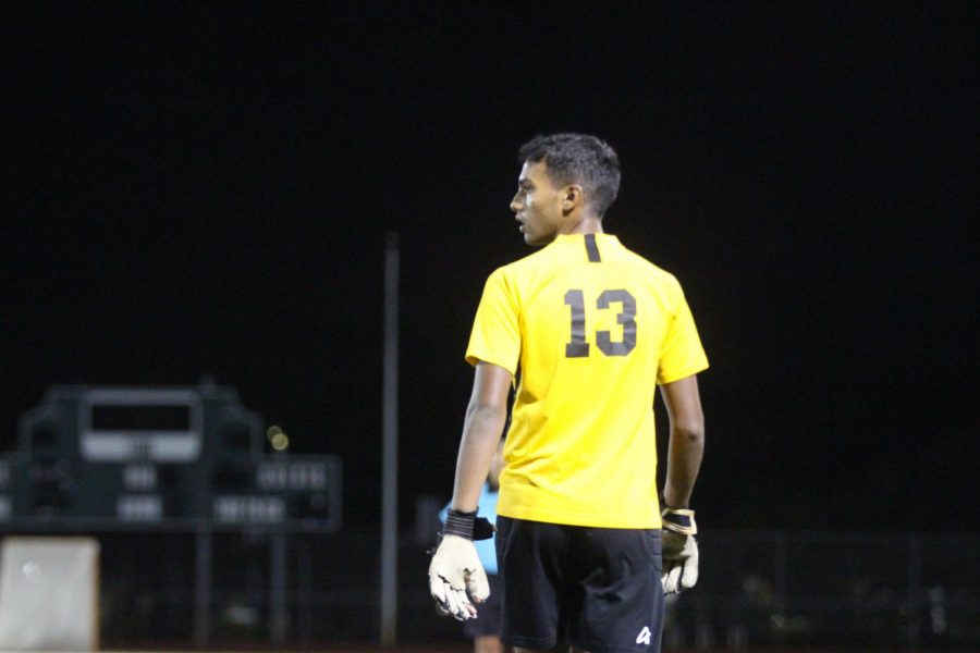 Visual senior Will Dhana walks towards the goal, watching the game in case the opposing team tries to score. Dhana played keeper in the game and was responsible for preventing the Jupiter team from scoring goals. “The hardest thing about playing keeper is the self-inflicted injuries,” Dhana said. “It’s extremely easy to get in and come out in a lot of pain.”