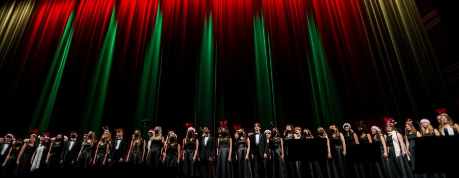 The 74 vocal students in the fifth-hour chorus span across the Kravis stage while singing “We Wish You a Merry Christmas.”