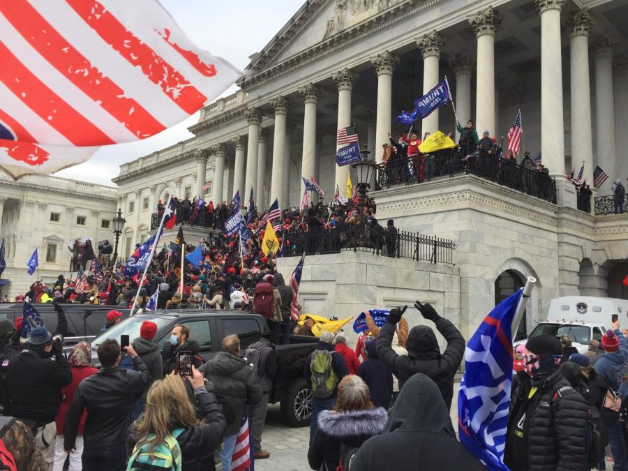 “Crowd of Trump supporters marching on the U.S. Capitol on Jan. 6, 2021, ultimately leading to the building being breached and several deaths.” 
“DC Capitol Storming” by TapTheForwardAssist via Wikimedia Commons.
