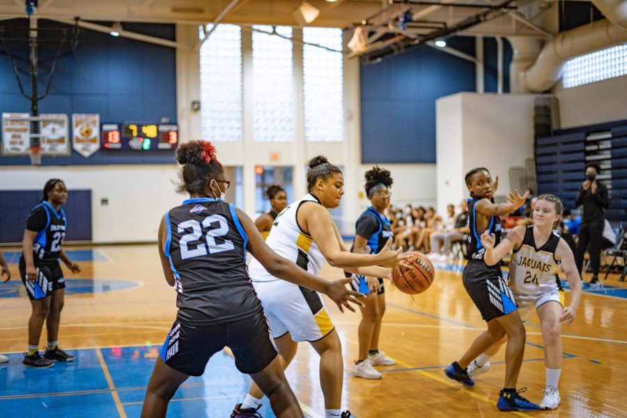 Communications senior Penelope Ryan gets a hold of the ball during a 10 point lead in the Jan. 10 game against Inlet Grove High School.
