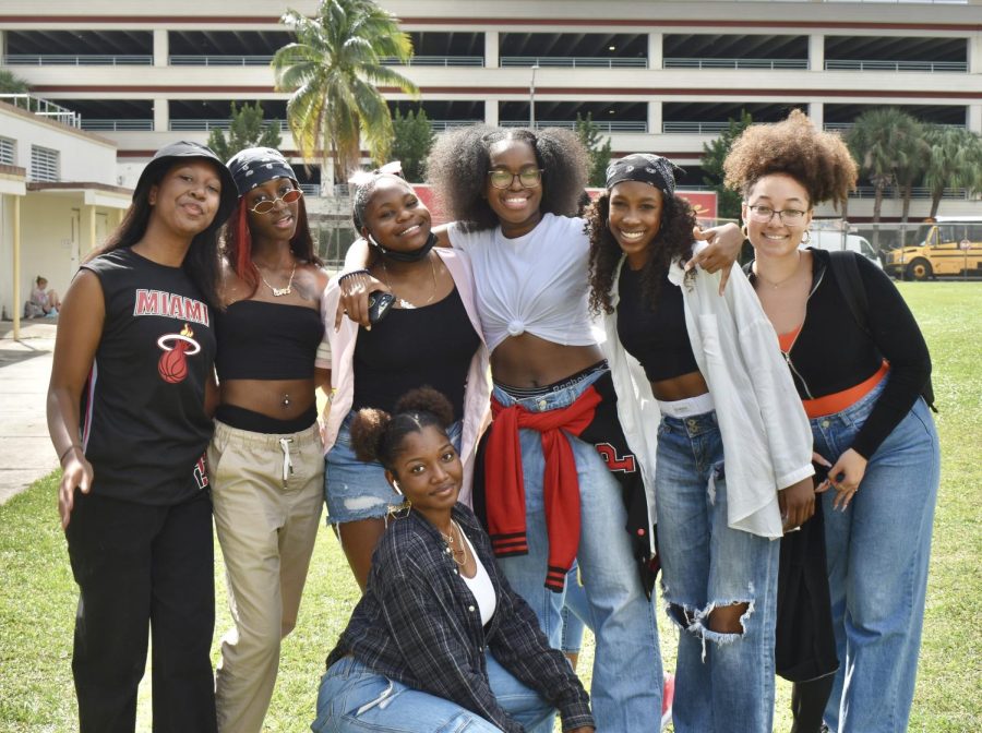 Members+of+the+Black+Student+Union+%28BSU%29+pose+for+a+photo%2C+displaying+their+take+on+1990s+outfits+%E2%80%94+a+crucial+period+in+black+culture.+