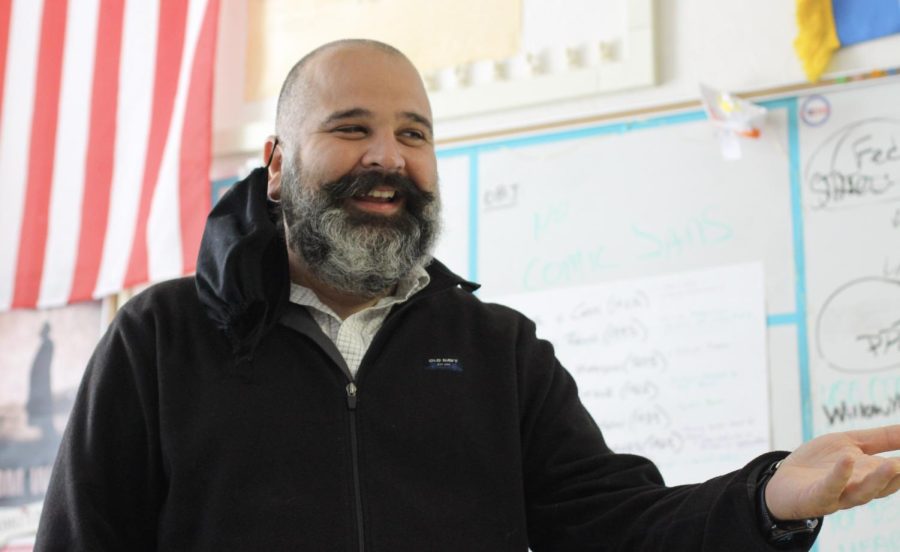 AP Government and Politics and Macroeconomics teacher Micheal Esopakis discusses supply and demand concepts with students as they complete a Venn diagram illustration. 
