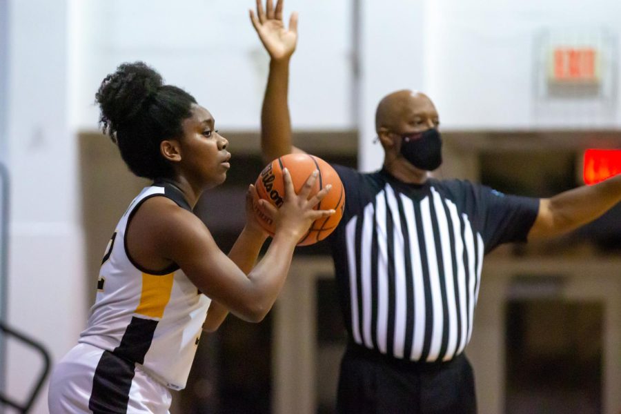 Communications senior and girls basketball co-captain Se’Maj Griffin throws the ball to the teams offensive players during their Senior Night against The Pine School on Dec. 28. The game finished as a 23-17 Dreyfoos loss.
