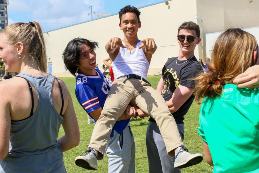 Piano juniors Nicholas Adia, Joshua Lumaban, and Arthur Schofield pose as they showcase their jock looks.