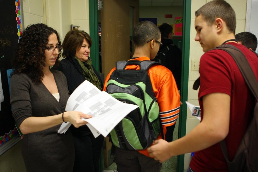 Ariel Mindel, left, of Mental Health America of Illinois, hands out information about depression and suicidal behavior after a presentation at Oak Lawn Community High School, January 26, 2011. At rear is high school social worker Carol Gustafson. Photo by Alex Garcia/Chicago Tribune/MCT