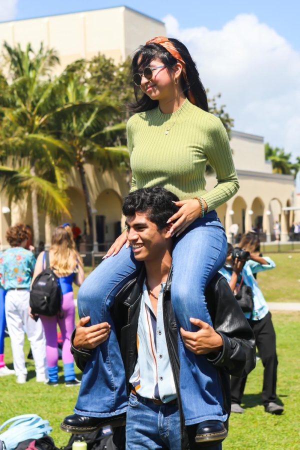 Smiling for the camera, vocal junior Jacqueline Alvarado (top) and visual junior Julian Leyva (bottom) pose for pictures on the field after the Generation Dances.  