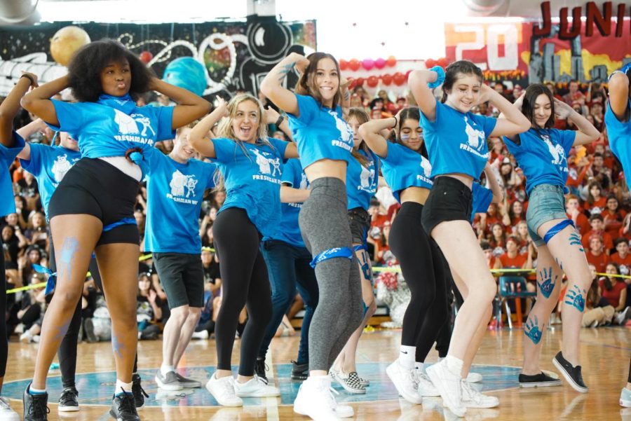 Current juniors dance in their freshman class shirts during the 2020 Pep Rally decked in their class color, blue.
