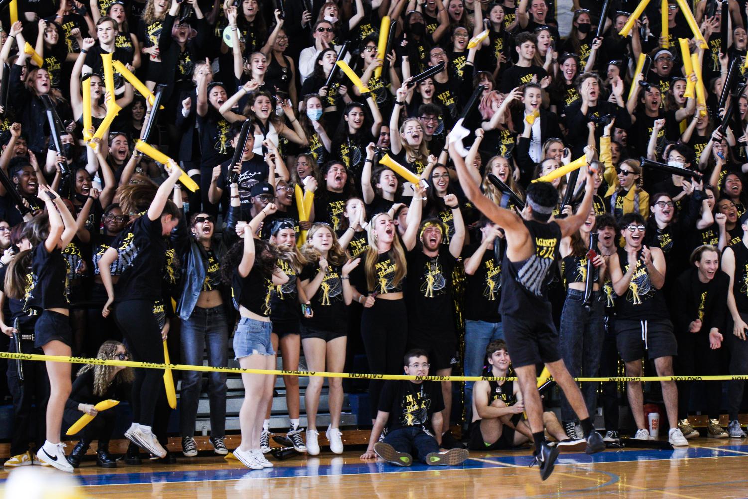 Cheering for the seniors’ Spirit Week win, SGA co-president and communications senior Sheevam Patel jumps in front of the senior section. 