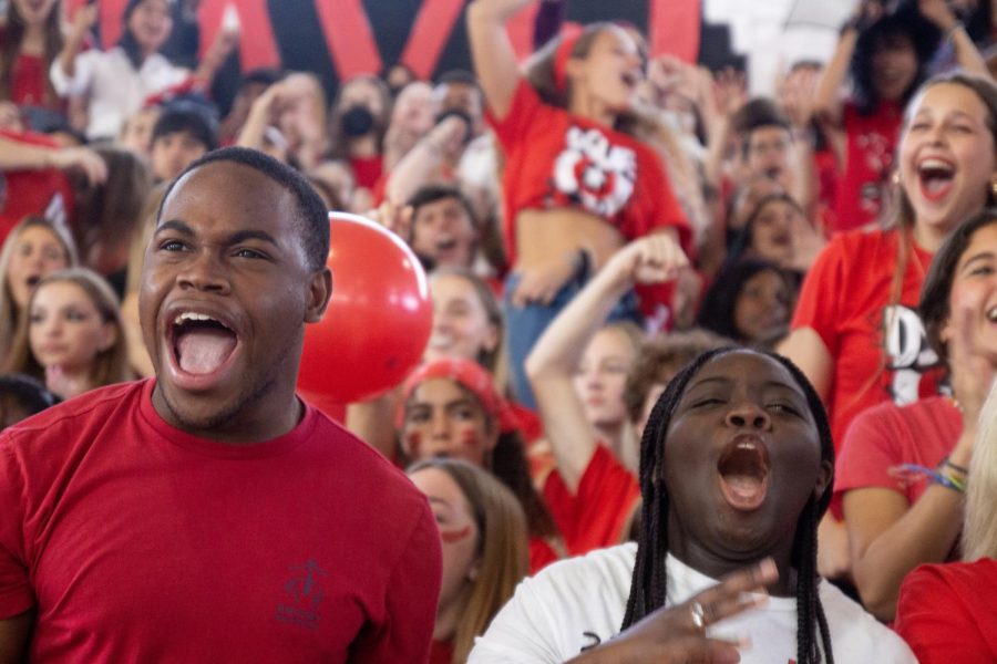 Piano junior Makens Joseph and strings junior Tyi Jones cheer on their class after a dance performance featuring choreography based around the junior classs theme: Marvel.