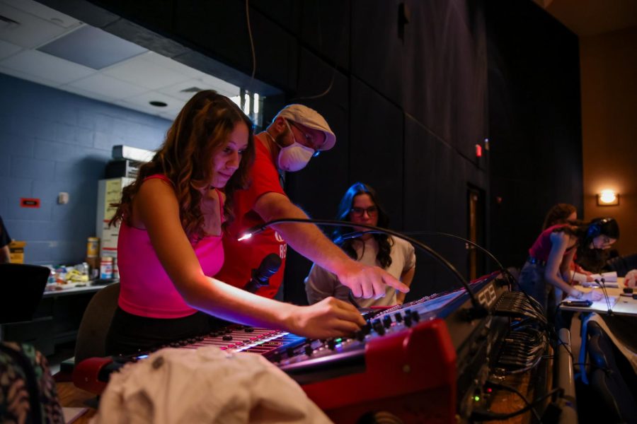 Sound designer Marty Mets guides sound crew co-heads and theatre juniors Amberly Rodriguez and Talia Pamatat through the process of altering the pitch and tone of an actor’s microphone. “For this position I came in knowing absolutely nothing. I started learning everything my freshman year and I’ve learned even more since then,” Rodriguez said.