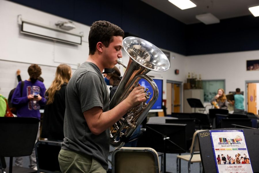 3:50 p.m: Band junior Cole Pasch practices the euphonium, a brass wind instrument, during an after-school rehearsal.

“I like staying after school for rehearsals because it means I get to spend more time playing in ensembles with my friends,” Pasch said. “After the rehearsal’s over, I’ll sometimes go out and get food with my friends.” 

“I think I prefer after-school rehearsals more because I get to end my day on a good foot — I’d get to play fun music, play with my friends, and not really have to worry about going to my next class after it’s done.”
