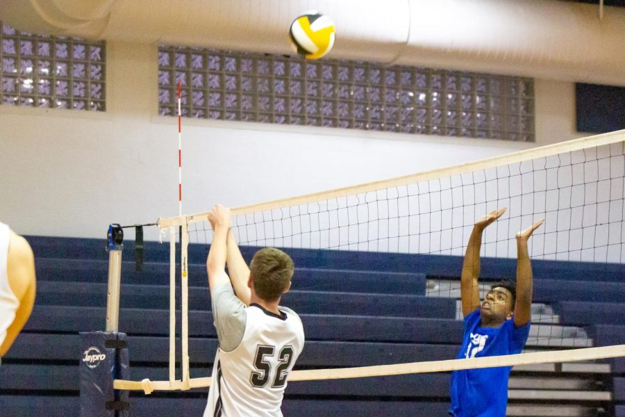 Visual junior and middle blocker Ryan Schlosbon hits an incoming spike, “anticipating” for the ball to be “tipped” down by his teammates, allowing a clean hit. “I wanted to be ready for that,” Schlosbon said. “I was just waiting for that moment.”