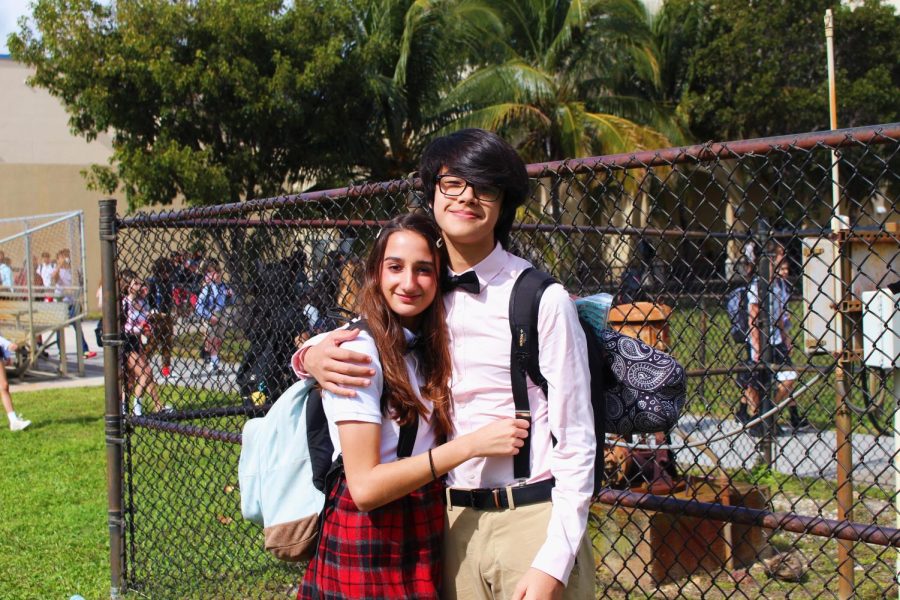 Band juniors Ava DeGaetano and Jake Dudley pose on the field dressed as nerds for Class Clique Day during the 2020 Spirit Week. Through bowties, plaid skirts, glasses, suspenders, and collared shirts, freshmen can design a nerd-themed outfit. 

