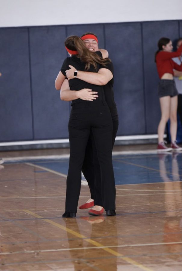 Principal Bennett hugs SGA advisor Sarah Ray during Pep Rally to show her thanks for all of the planning that went into Spirit Week.