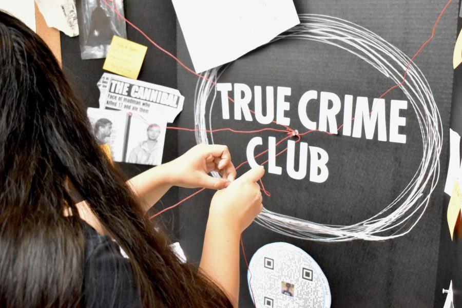 Winding strings across her board, band senior Aida Martinez-Lopez prepares her table. Club Rush led to the creation of new clubs and provided students with the opportunity to recruit new members. “This is a new club, and we dont have a lot of people that we know ourselves,” said Martinez-Lopez. “So we just wanted to come to Club Rush and have the opportunity for other people to know about this.”
