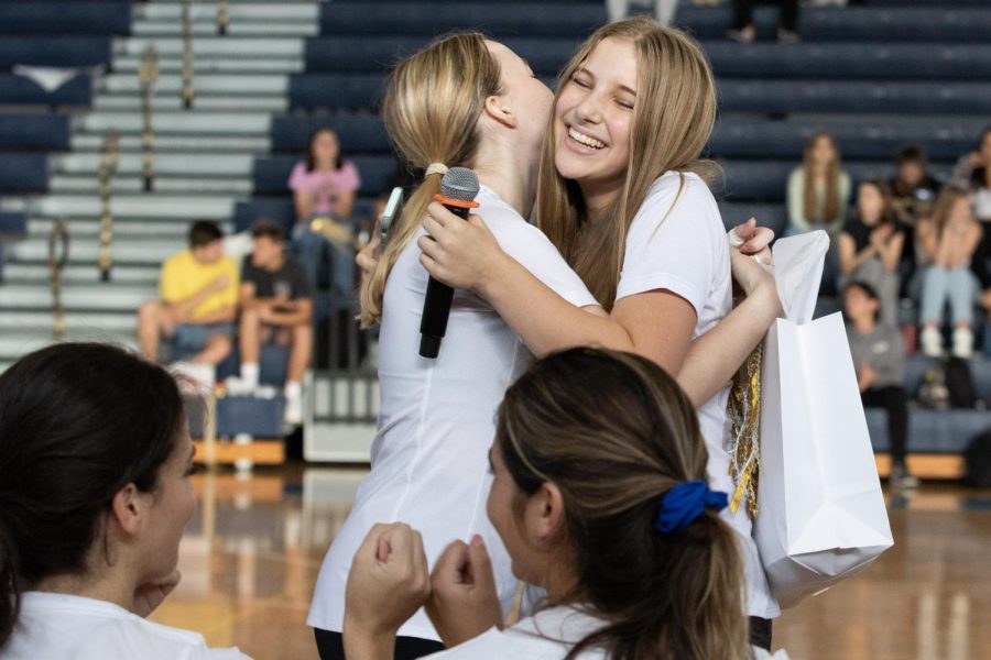 After giving her junior to senior speech, theatre junior Adaleigh Wagner hugs visual senior Zofia Killeen. This annual tradition allows a junior to write a speech for a senior they are close to. “(Wagner) and I have been playing together for two years, and we have become such good friends,” Killeen said. “It meant so much that she made my speech, and it made my eyes water a little bit.”  
