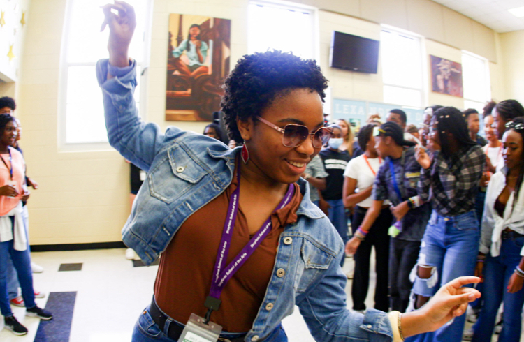 Dancing to the music, theatre sophomore Satya Hamilton moves down the center of the Soul Train while her peers cheer her on. 
