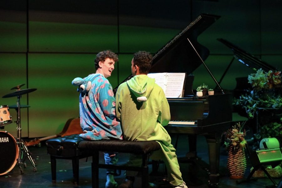 Urging the audience to snap along, piano seniors Joshua Lumaban and Arthur Schofield play a song inspired by the movie “Monsters Inc.” During their piece, they drew the audience in as they switched spots and ran around each other throughout the song. “I havent played a duet with AJ since last year,”  Lumaban said. “We chose the piece because we watched a YouTube video and actually really liked what the YouTube video showed us.”
