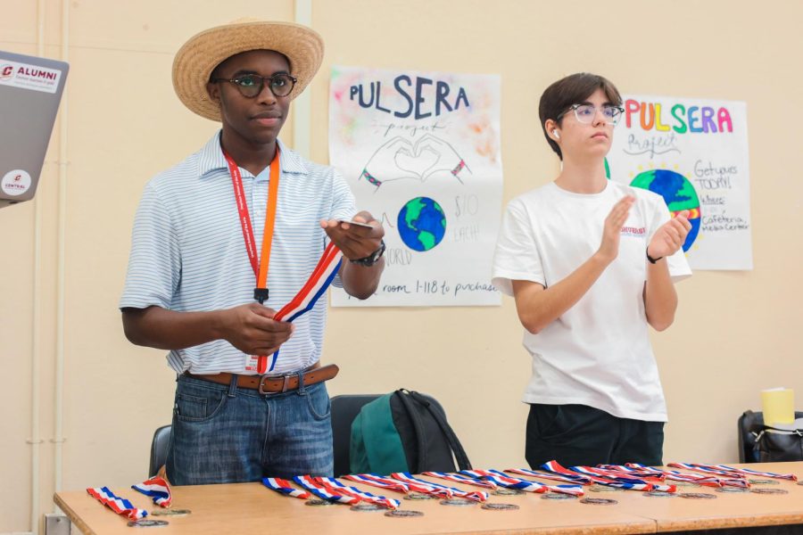 Handing out medals, communications juniors Callum Curran and Josiah Manners congratulate the winners in Original Oratory, an original 10-minute memorized speech. “The most humbling experience was being able to present medallions to students, some of whom were my own fellow debate team members,” Manners said. “To see the excitement in their eyes and to feel the gratitude in their hearts was what really made my job even more special.”