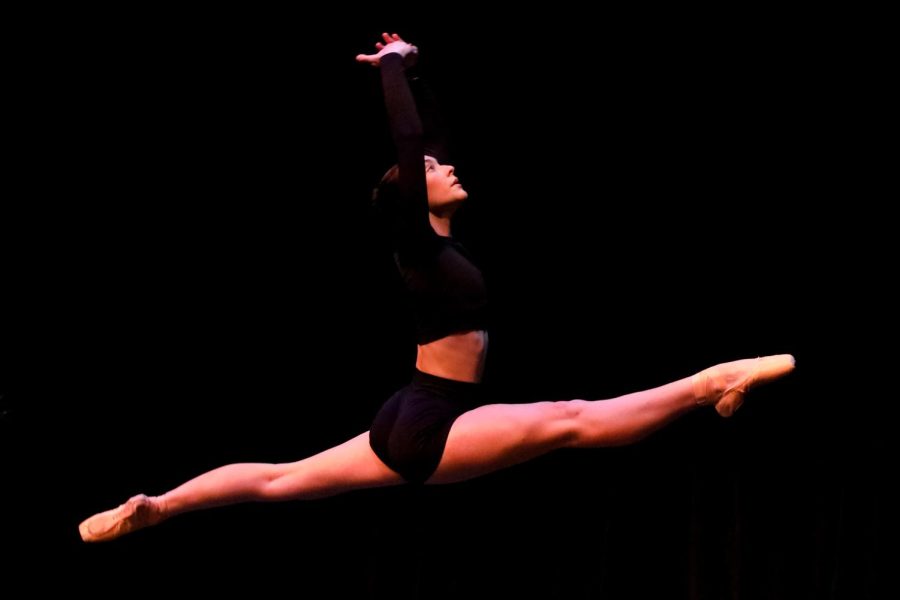 With her legs extended for a grand jeté, dance senior Lindsey Ryerson performs her solo, “Life,” during the annual Dance Senior Solo Showcase. The Senior Solo Showcase on Sept. 23 allowed students to include the skills they have learned during their time at Dreyfoos. “Being in the black box was definitely different because during the performance, since the black box is so small, I was able to see every single person,” Ryerson said. “I was excited and a little bit nervous because I didn’t want to mess up on stage.”
