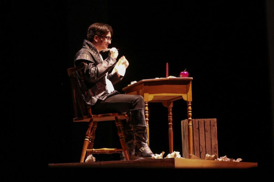 Under the spotlight, theatre junior Von Markarian sits at his desk onstage while trying to figure out what to write in his play. “This show has been not the most prop heavy, but we had to make a lot of paper. Its about Shakespeare. Everybodys writing and reading the whole time,” theatre junior Lucas Green said. “We didnt want everybody to just be reading off of like bleached white paper. So we had to dye sheets of paper. We dyed them all brown with coffee.” 