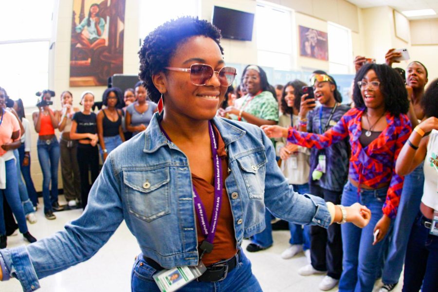As students clap and cheer around her, theatre sophomore Satya Hamilton dances to “Let’s Groove” by Earth, Wind & Fire. BSU’s “Soul Train” themed block party on Oct. 9 brought the ‘70s and ‘80s to the cafeteria through disco music and patterned outfits. 
