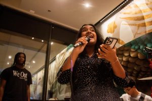Looking out into the crowd, communications senior Manha Chowdhury performs her opening speech. Asian Cultural Society’s (ACS) Open Mic Night was not only for the Asian community but also for students to come out and express themselves. 

Caption by Haiden Kenney