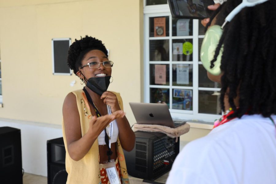 BSU co-secretary and visual senior Akilah McKinnon smiles as BSU co-historian and communications junior Eduardo Culmer records her dancing during the block party. Students did different dances, such as the “Wobble.”