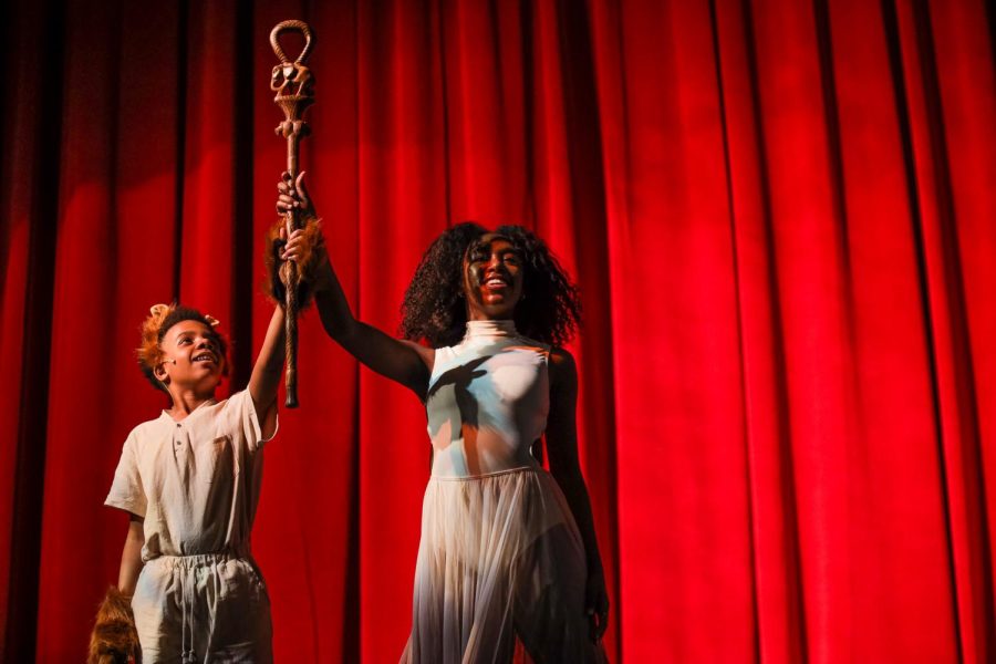 Theatre freshman Kevontay Oliver and dance senior Gabrielle Kiminyo hold up a walking stick after Kimonyo finished her solo to “King of Pride Rock” by Hans Zimmer from “The Lion King” during Black Student Union’s (BSU) “Black on Broadway” showcase. 
