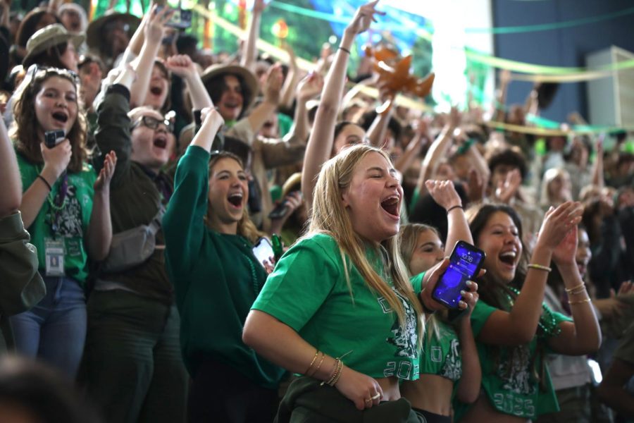 Communications sophomore Charlotte Handel cheers on with others during the Pep Rally., 
