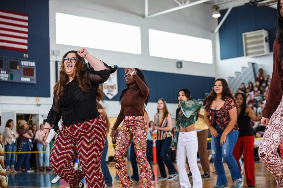Generation dance co-choreographer and vocal junior Aileen Pereda leads the juniors in their ‘70s-inspired dance.
