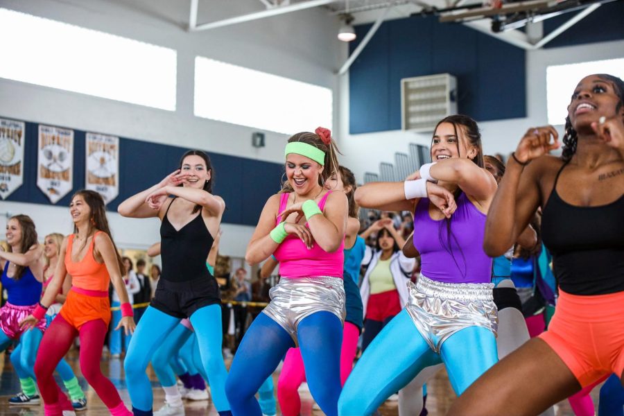 Dance senior Lindsey Ryerson, theatre senior Mary Keith, and dance senior Alexis Carter do jazzercise moves to the song “Push It” by Salt-N-Pepa in the senior generation dance.