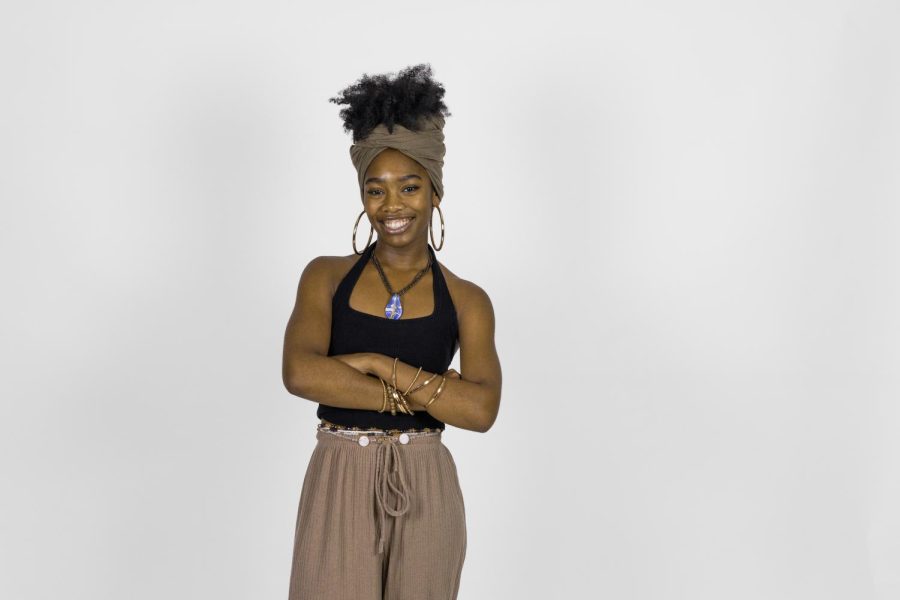  Theatre junior Lillian Jones, illustrator of “The Very Hungry Little Girl”, poses arms crossed in the muse studio. 
