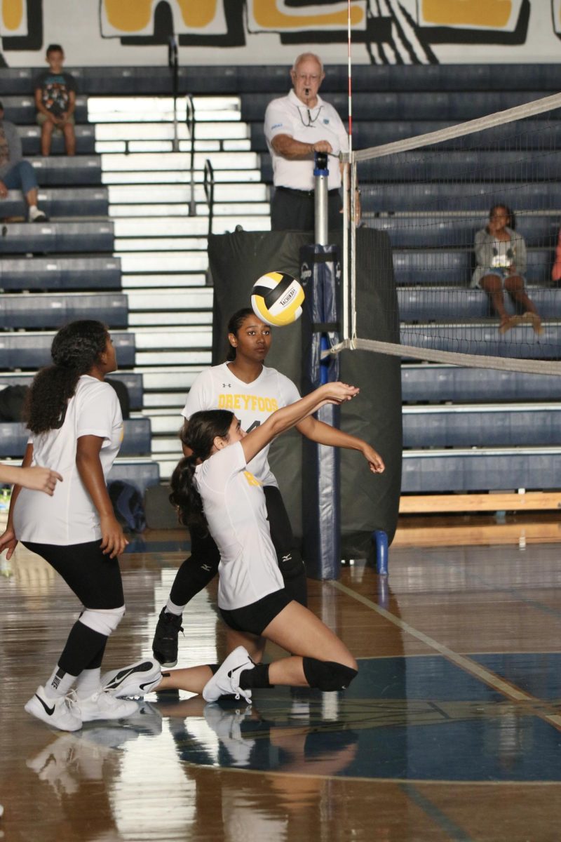 Sliding to save a block, Hinav Ahmad angles the ball to her teammates.  “Im getting experience that I really need, just playing through these games,” Ahmad said. “I feel like I have more of a shot for varsity next year.”
