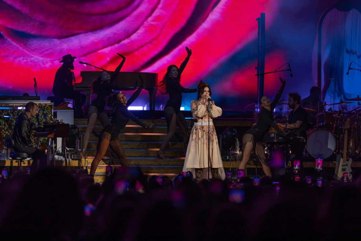 Singing at iThink Financial Amphitheatre, contemporary pop artist Lana Del Rey performs a sold out show in front of an audience of almost 20,000 people. Rey came to Palm Beach under her small amphitheater tour showcasing her most popular songs while also promoting her new album, “Did You Know That Theres a Tunnel Under Ocean Blvd.”
