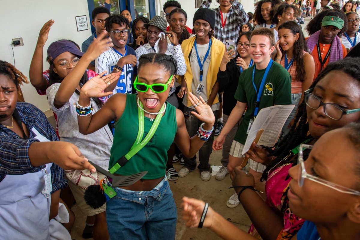 In the center of a cheering crowd, theatre sophomore Aissa Duclervil dances at Black Student Union (BSU)’s first block party of the year.  The party saw attendees in costumes, including different variations of the “barbecue dad, as they sang with their peers.
