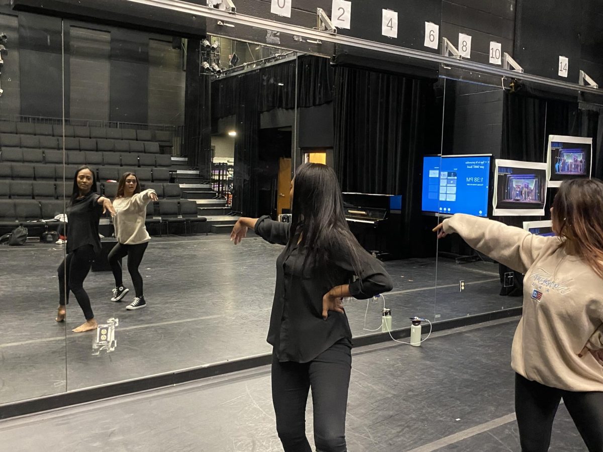 Mirroring Mrs. Christie, theatre senior Isabela Aronson practices her choreography to “Does Your Mother Know” from “Mamma Mia!”
