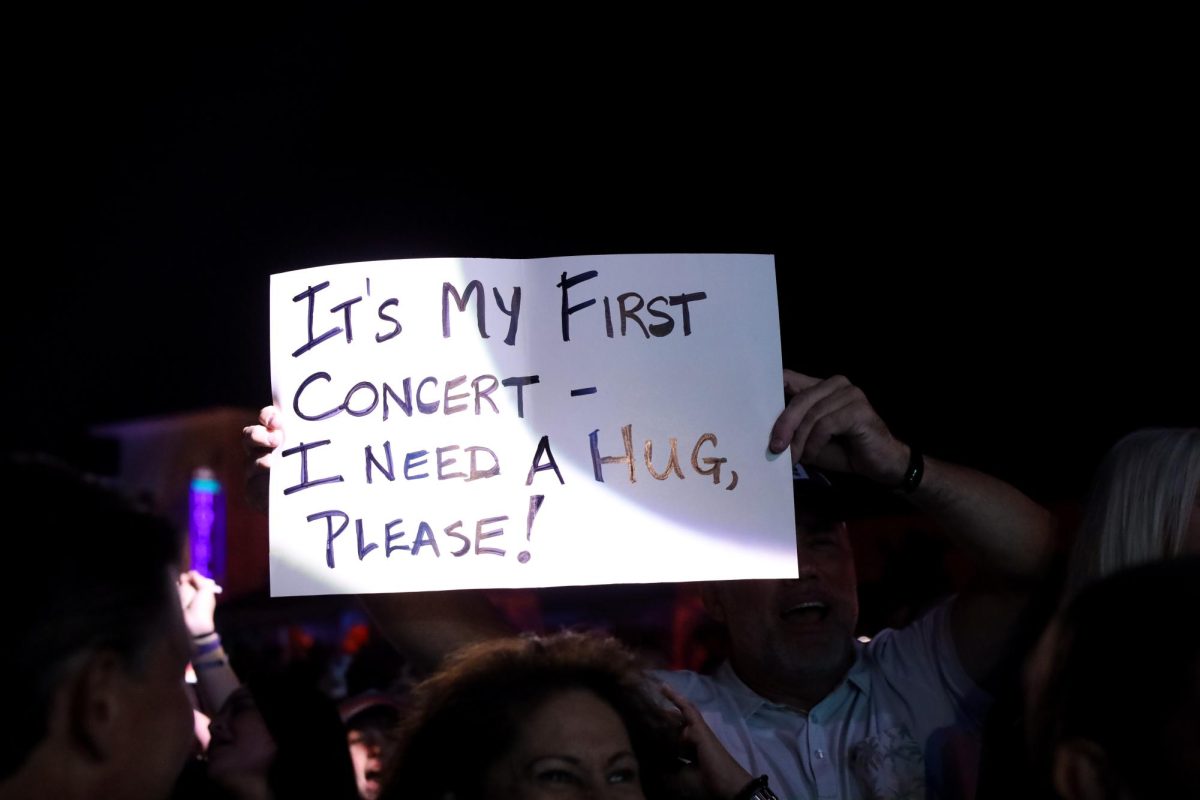 A Luke Byran fan holds up a handmade sign during the concert. 