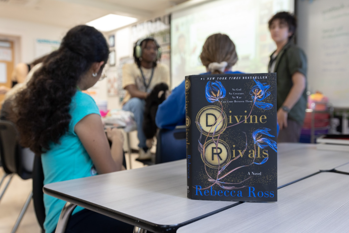 Members of the Book Club discuss the fantasy romance novel “Divine Rivals” at their meeting on Monday, Dec 4. 