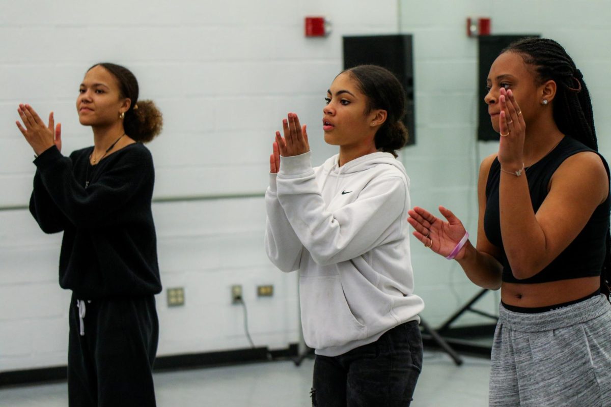 Using their bodies as instruments and creating rhythmic beats through unified sounds of clapping, footsteps, and noises, the Step Team practices together in the dance studio.
