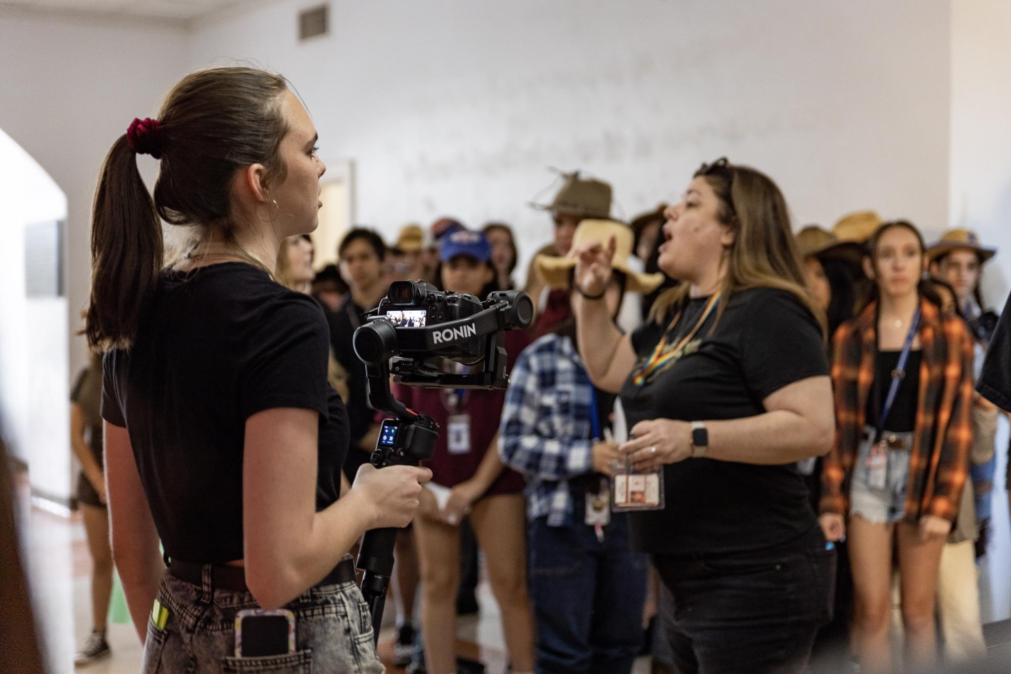 Dreyfoos alumnus Lexi Critchett gives orders to a group of communications students during one of the multiple filmings of the 2022-2023 school year lip dub. To streamline the process, the filming of the lip dub is being shot in intervals at special school occasions throughout 2023 and 2024.
