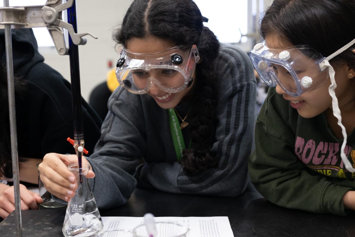 Observing potassium pomegranate droplets react with an acid, piano sophomore Mili Dagan engages in a chemistry lab in Ms. PH’s class. During the experiment, Dagan conducts a titration — a technique in which a solution of known concentration is used to ascertain the concentration of an unknown solution.