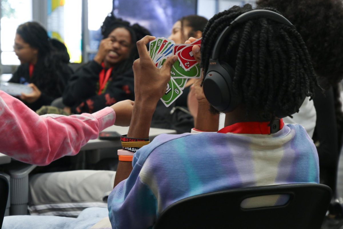 Theatre junior Adon Mckinnon examines his cards.