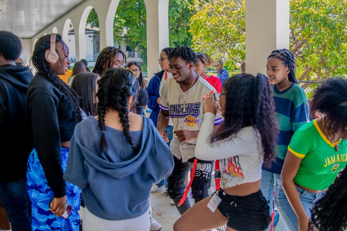 Strings junior Christian Onyewumbu dances, surrounded by fellow Black Student Union (BSU) members. Several songs played during the block party, including “Water” by Tyla. 