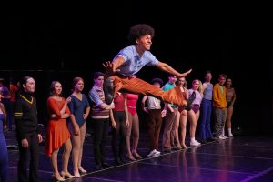Jumping into the air and kicking his legs out, theatre freshman Devin Jackson, playing the character Mike, explains his backstory. 