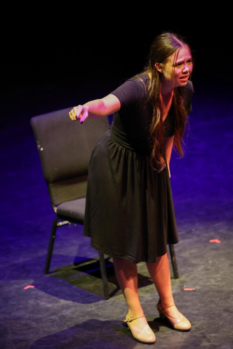 Pointing to the audience, theatre freshman Alisa Voloshina performs a monologue from “The Crucible.” “I think that this specific showcase was special because, with it being in the middle of exam season, we could not get any additional desired time after school to run the show, combined with all of its technical elements,” Voloshina said. “Nevertheless, I believe the show did run rather smoothly, and it all worked out well in the end.”