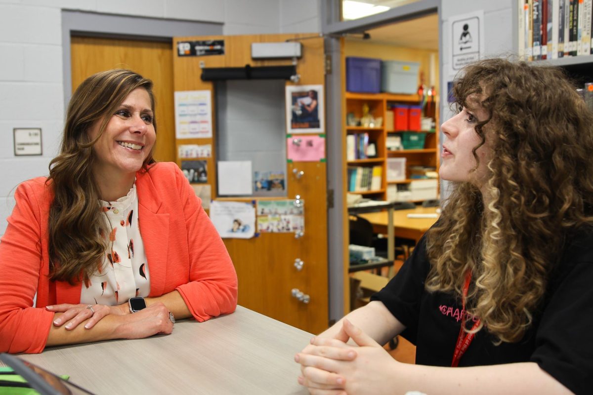 Laughing together, visual junior Willow Schar talks about her weekend plans with Principal Blake Bennett. “We were talking about celebrating the birthday of someone we both happened to know,” Schar said. “What a small world we’re in. I’m ready for the weekend!”